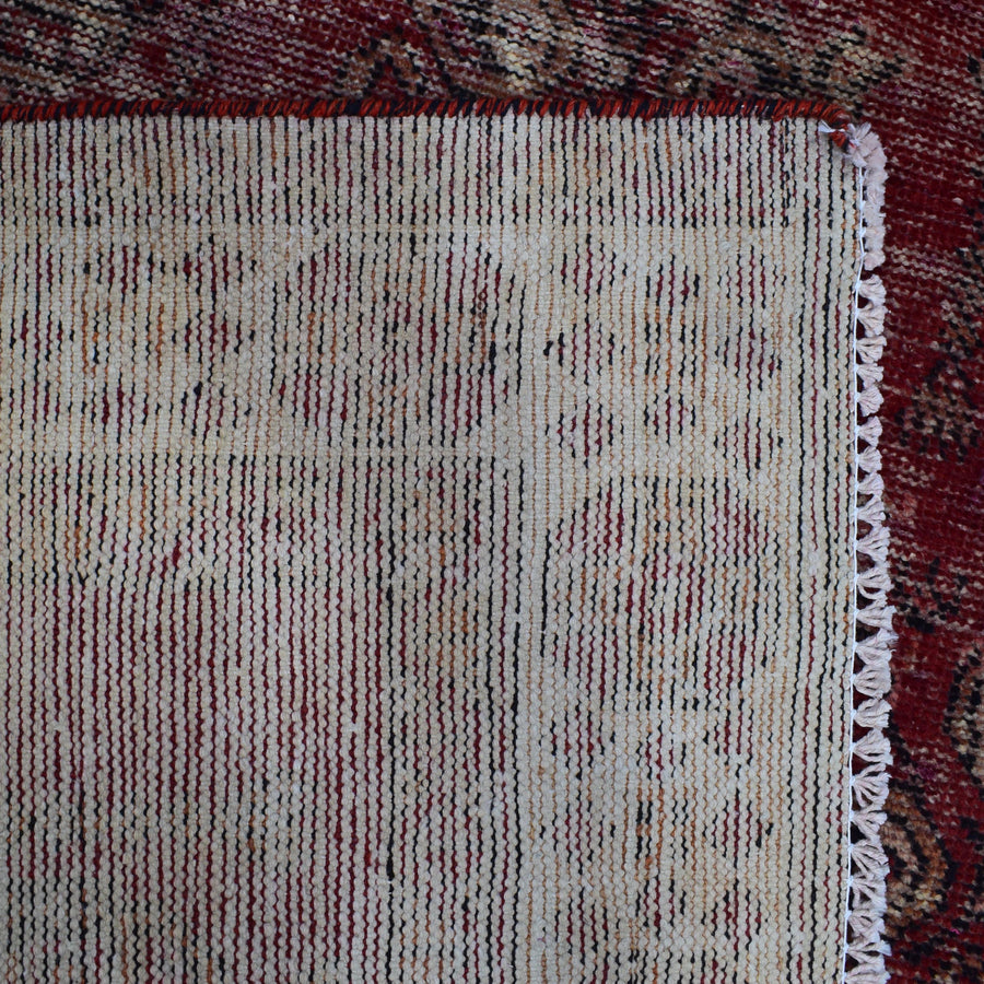 Backside of hand knotted Shiraz rug showing weave structure and traditional wool foundation