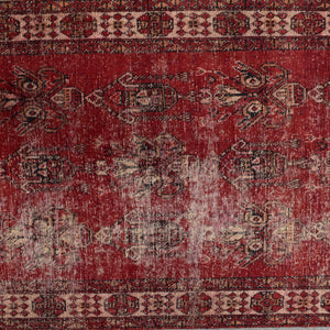 Detailed midsection view of Shiraz rug with weathered pattern and muted ivory accents