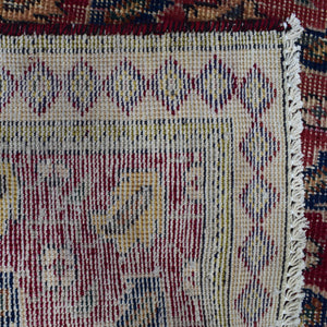 Backside of hand knotted Persian Shiraz rug showing tight weave structure and traditional geometric pattern