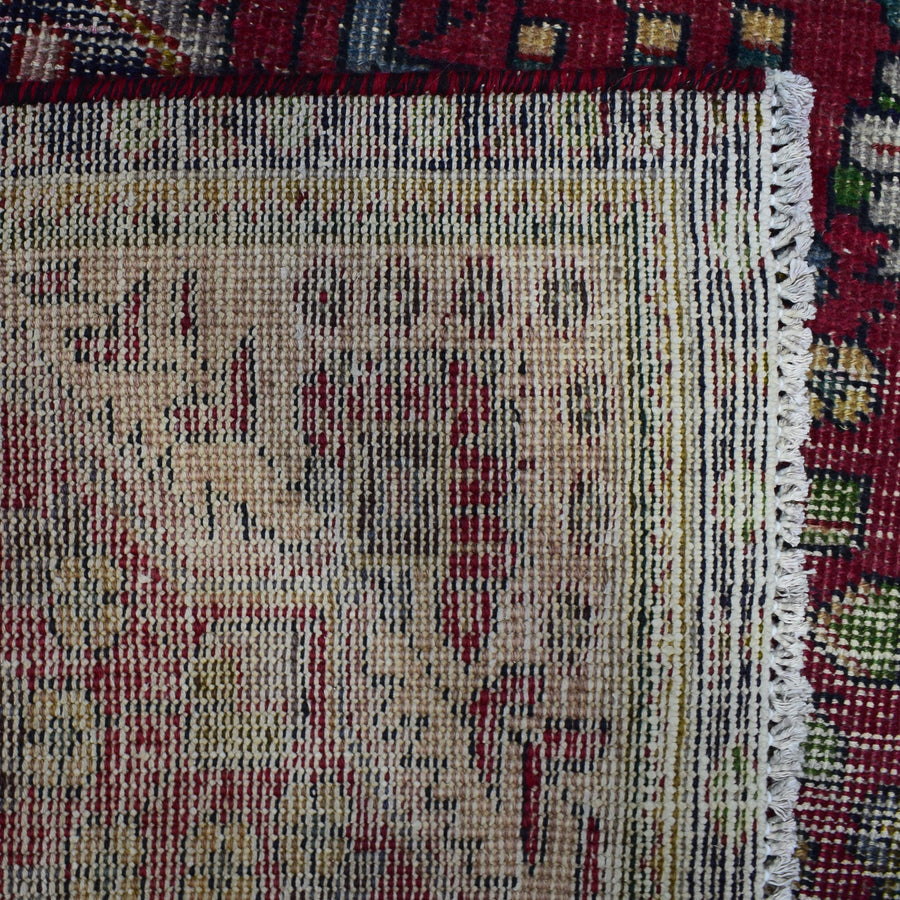 Backside of hand knotted Persian Shiraz rug showing tight weave structure and authentic handmade construction