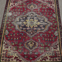 Detailed view of Shiraz Persian rug with ornate central medallion surrounded by small geometric tribal motifs
