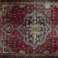 Close up of vintage Persian Shiraz rug medallion showing intricate geometric patterns in ivory, blue and red tones