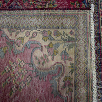 Backside of hand knotted Persian Shiraz rug showing tight weave structure and authentic handmade construction