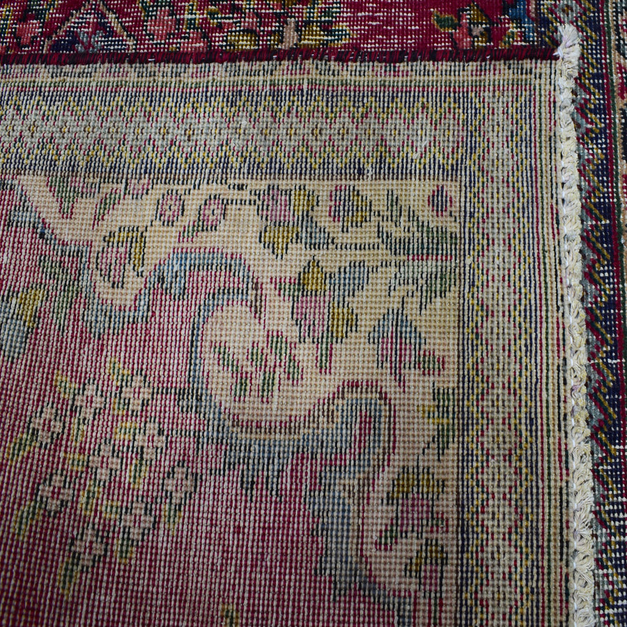 Backside of hand knotted Persian Shiraz rug showing tight weave structure and authentic handmade construction