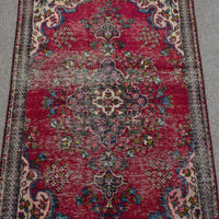 Detailed view of vintage Persian Shiraz rug highlighting ornate central medallion and surrounding floral motifs