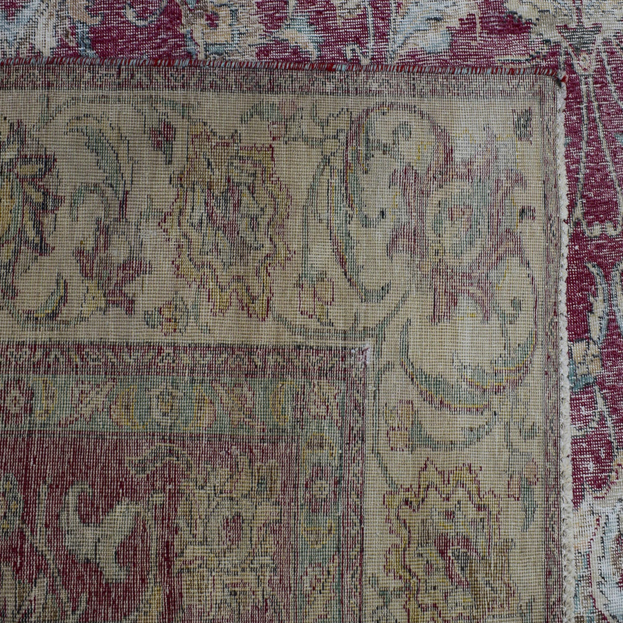 Backside of hand knotted Persian rug showing weave structure and authentic handmade construction