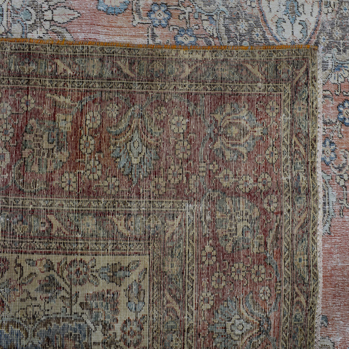 Backside of hand knotted Persian rug showing weave structure and authentic handmade construction