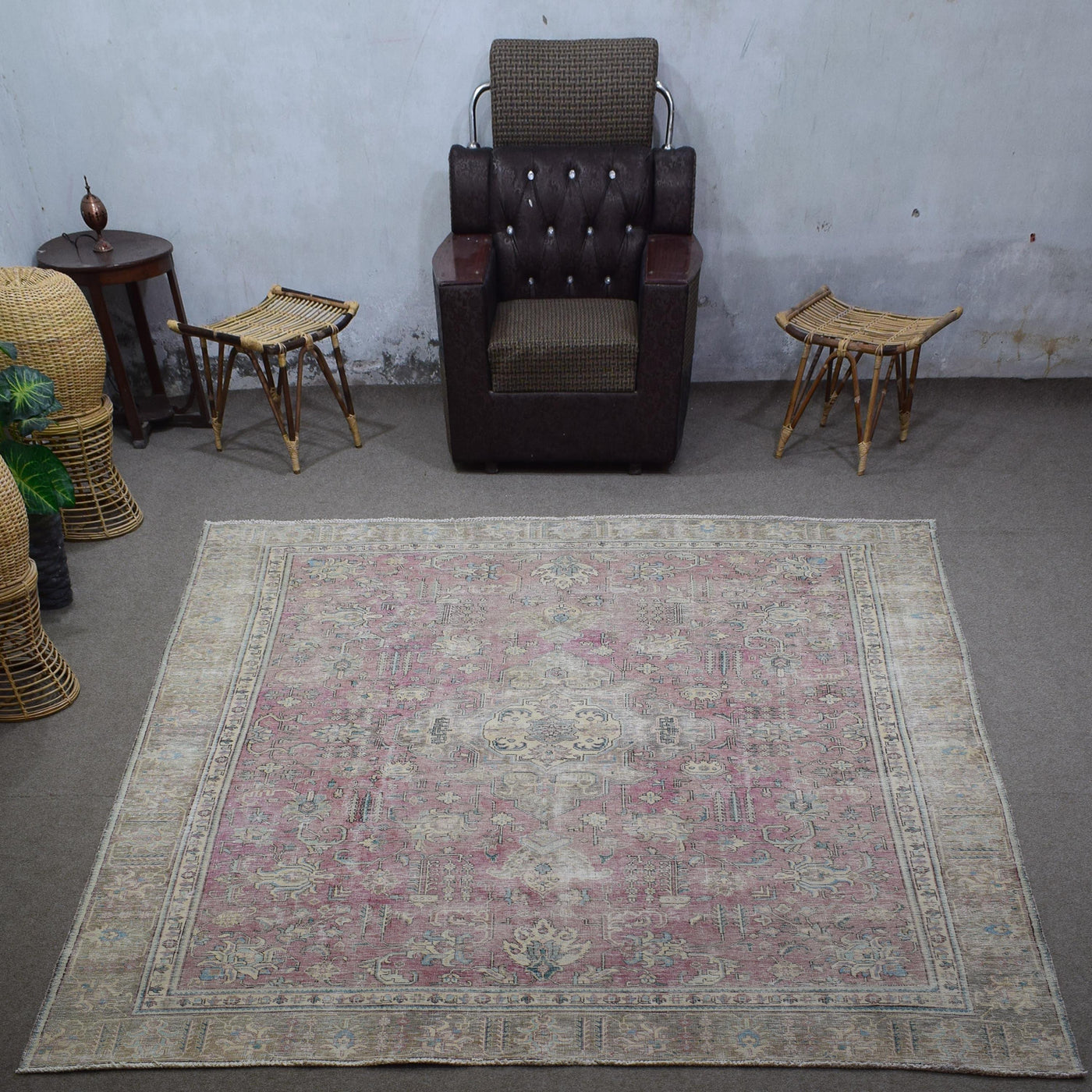Large distressed vintage Persian rug 275x363 cm styled in interior showing muted rose tones and traditional Persian design
