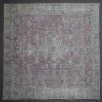 Close up of Persian rug border with traditional floral motifs and ivory guard stripes