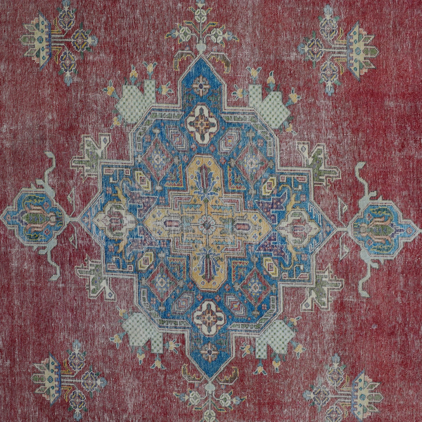 Detailed view of vintage Persian rug medallion featuring intricate geometric and floral elements