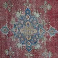 Detailed view of vintage Persian rug medallion featuring intricate geometric and floral elements