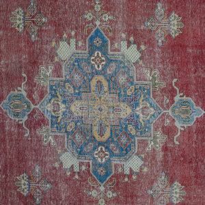 Detailed view of vintage Persian rug medallion featuring intricate geometric and floral elements