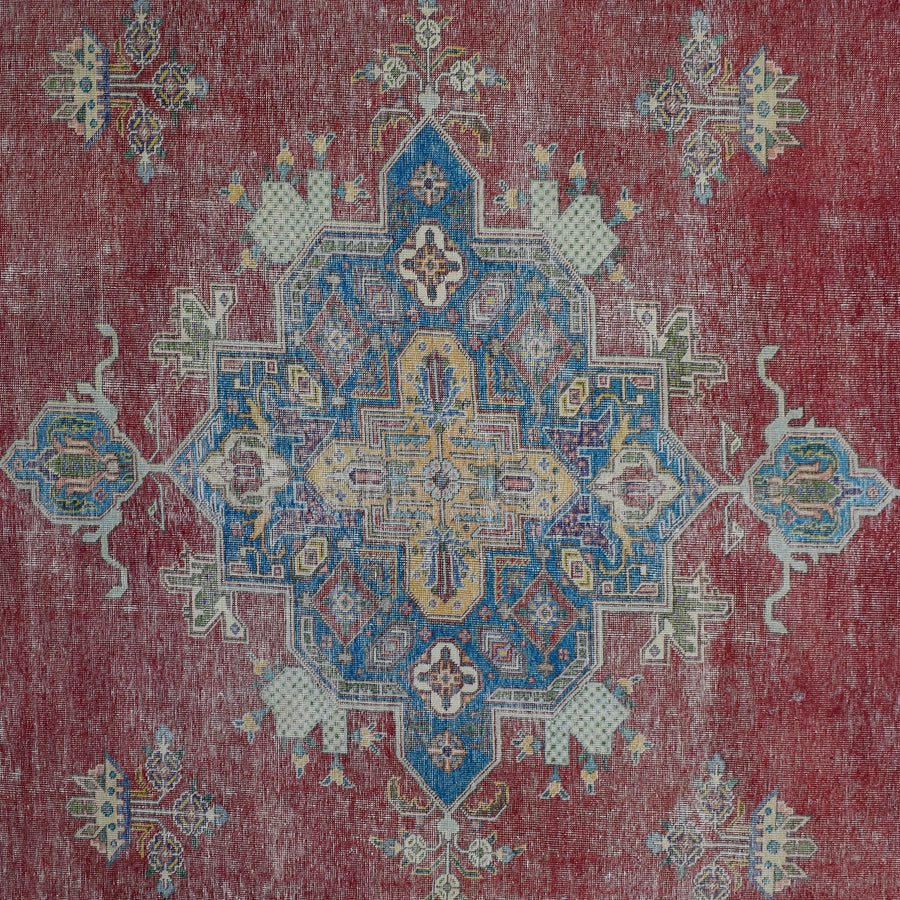 Detailed view of vintage Persian rug medallion featuring intricate geometric and floral elements