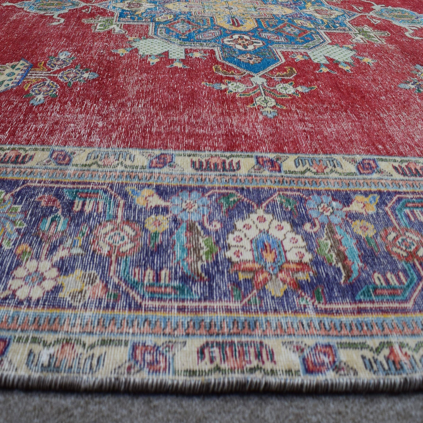 Macro detail of Persian rug medallion highlighting geometric patterns and wool texture