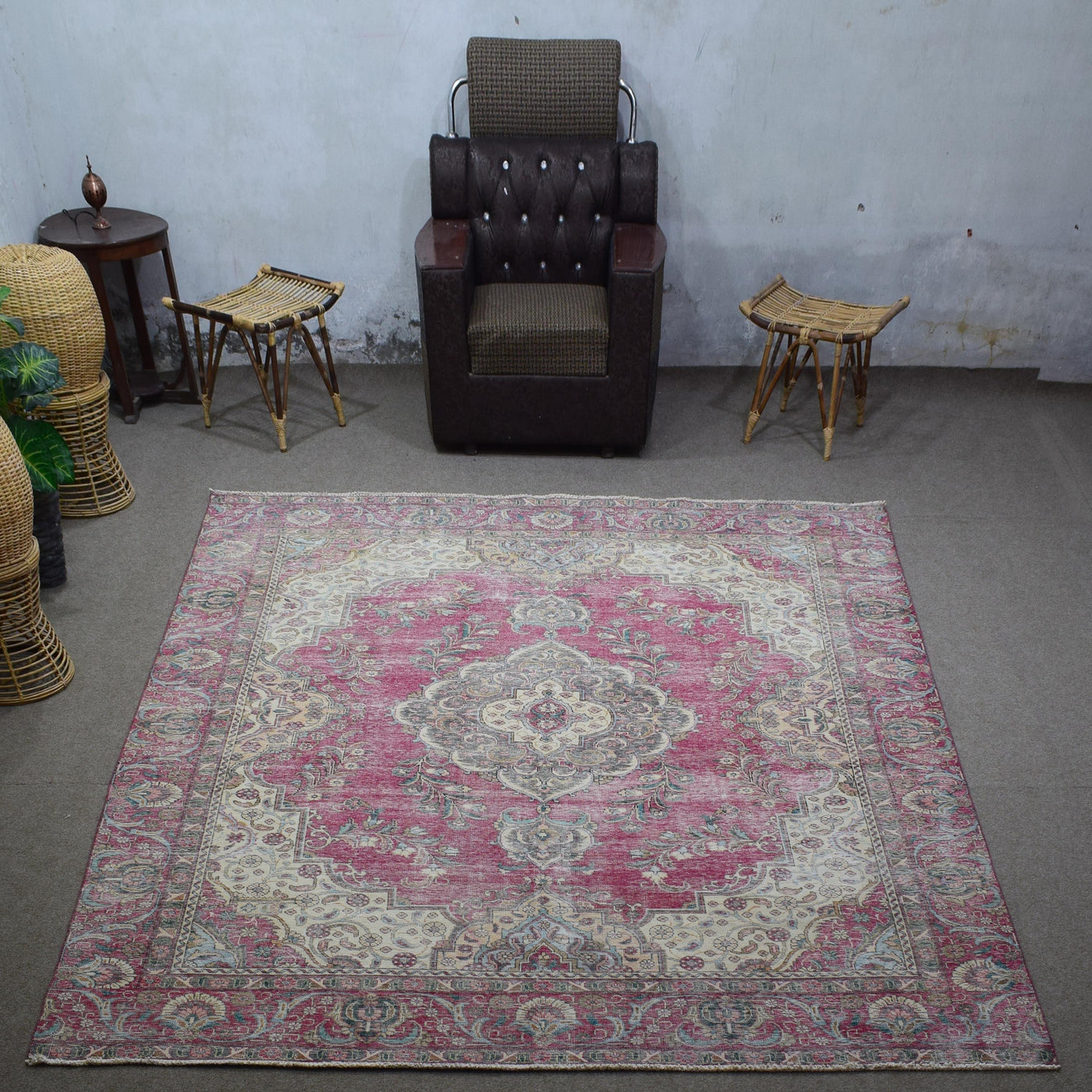 Large distressed vintage Persian rug 272x366 cm styled in interior showing worn rose tones and traditional Persian design