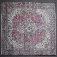 Close up of Persian rug border with traditional floral motifs and intricate guard stripes