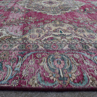 Macro close up of Persian rug medallion highlighting detailed floral elements and wool texture