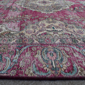 Macro close up of Persian rug medallion highlighting detailed floral elements and wool texture