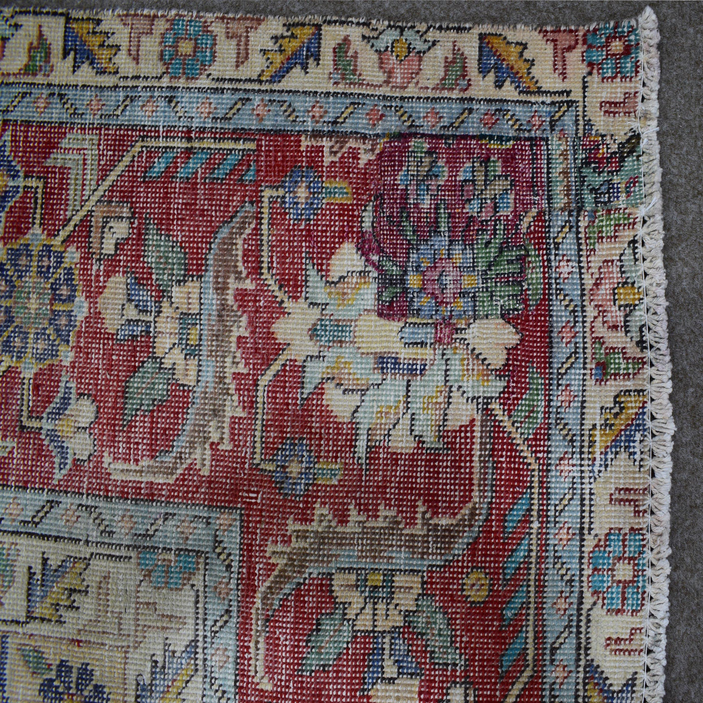 Backside of hand knotted Persian rug showing weave structure and authentic handmade construction