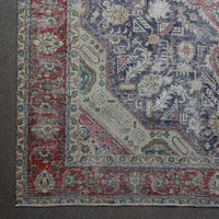 Corner detail of Persian rug with decorative border and traditional Persian motifs in navy and ivory