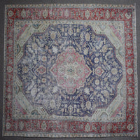 Close up of Persian rug border with colorful floral motifs and intricate guard stripes