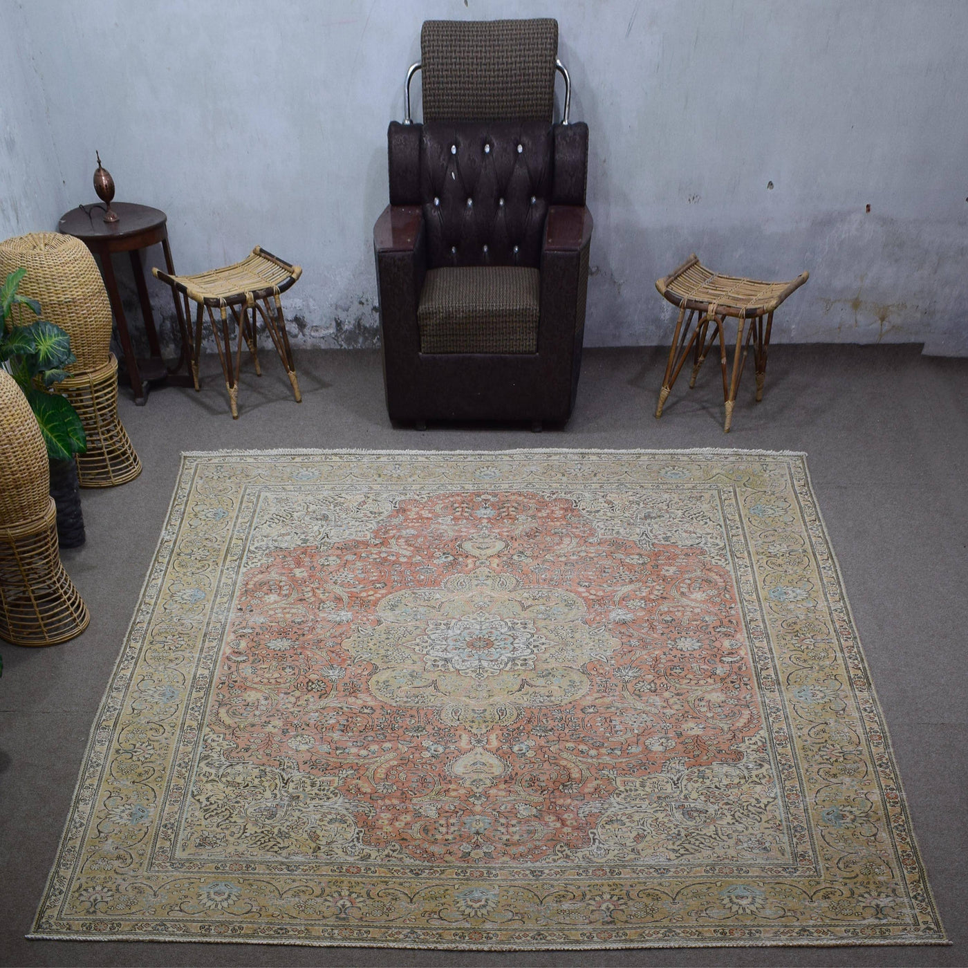 Large distressed vintage Persian rug 305x383 cm styled in interior showing soft coral tones and classic medallion design