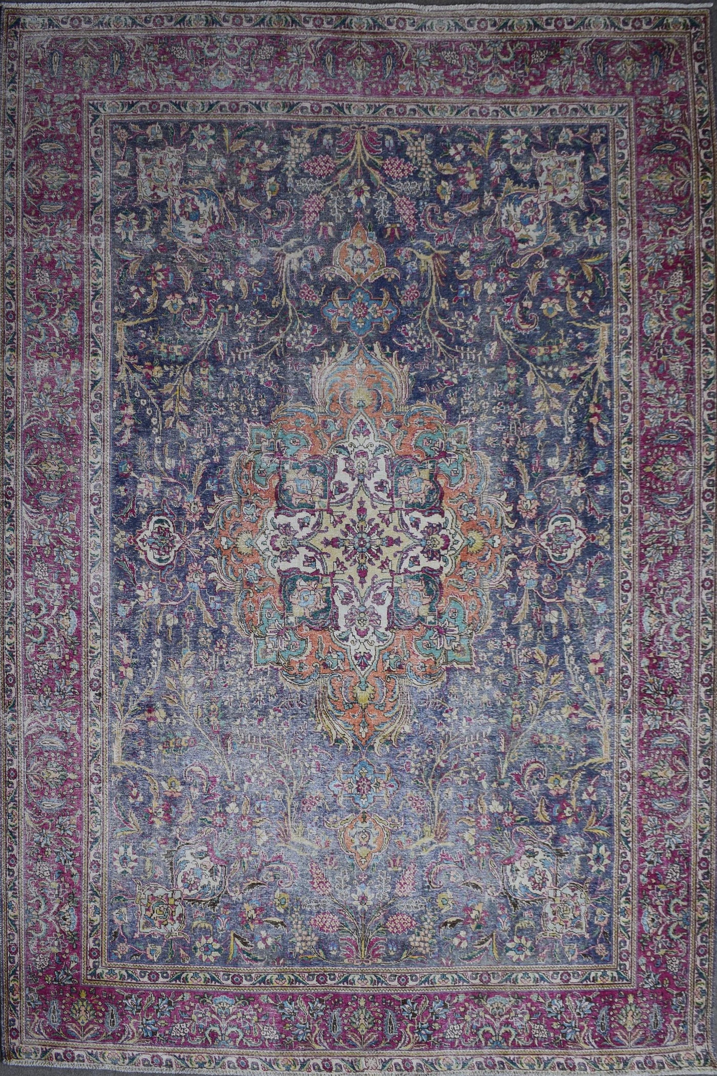 Distressed hand knotted vintage Persian rug 295x366 cm with dark navy field and ornate floral medallion