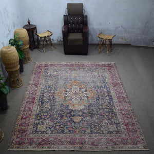Large distressed vintage Persian rug 295x366 cm styled in interior showing deep navy background and intricate medallion design