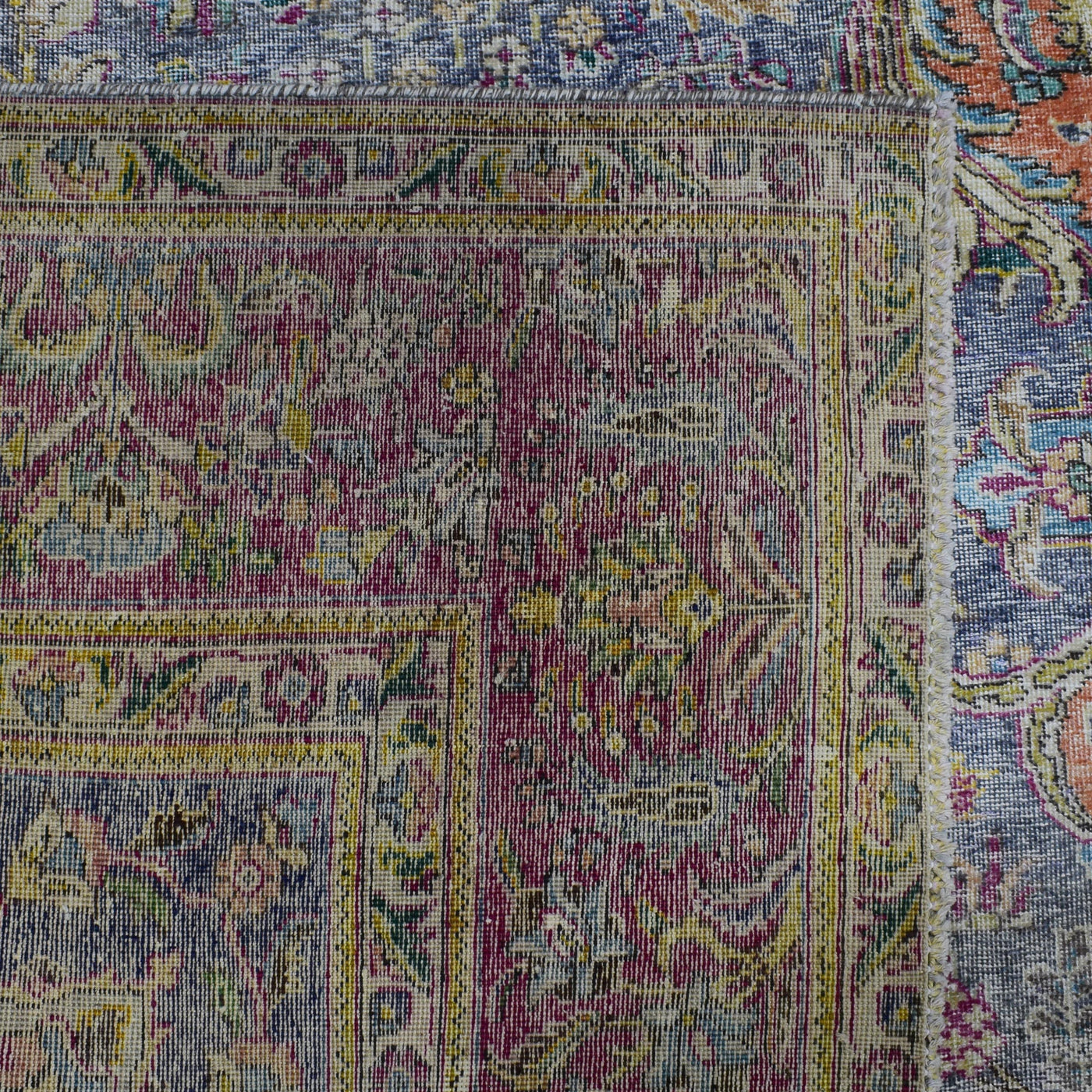 Backside of hand knotted Persian rug showing weave structure and authentic handmade construction
