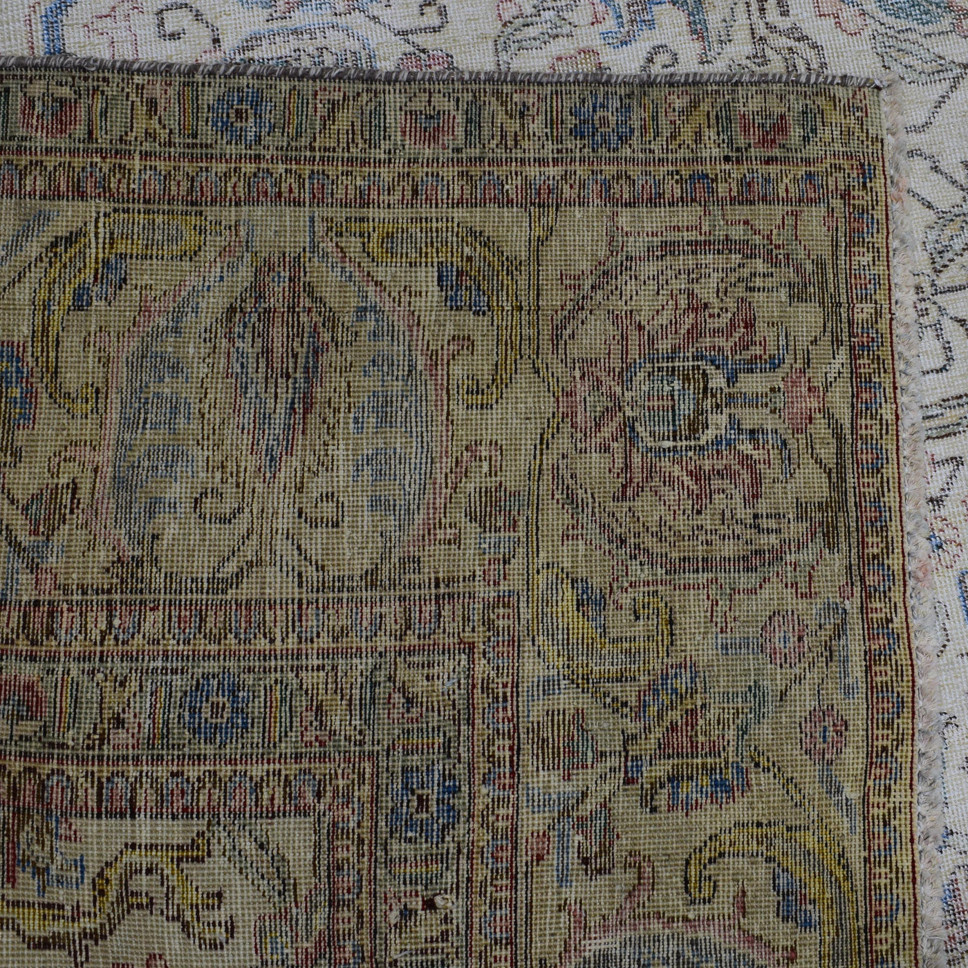 Backside of hand knotted Persian rug showing weave structure and authentic handmade construction