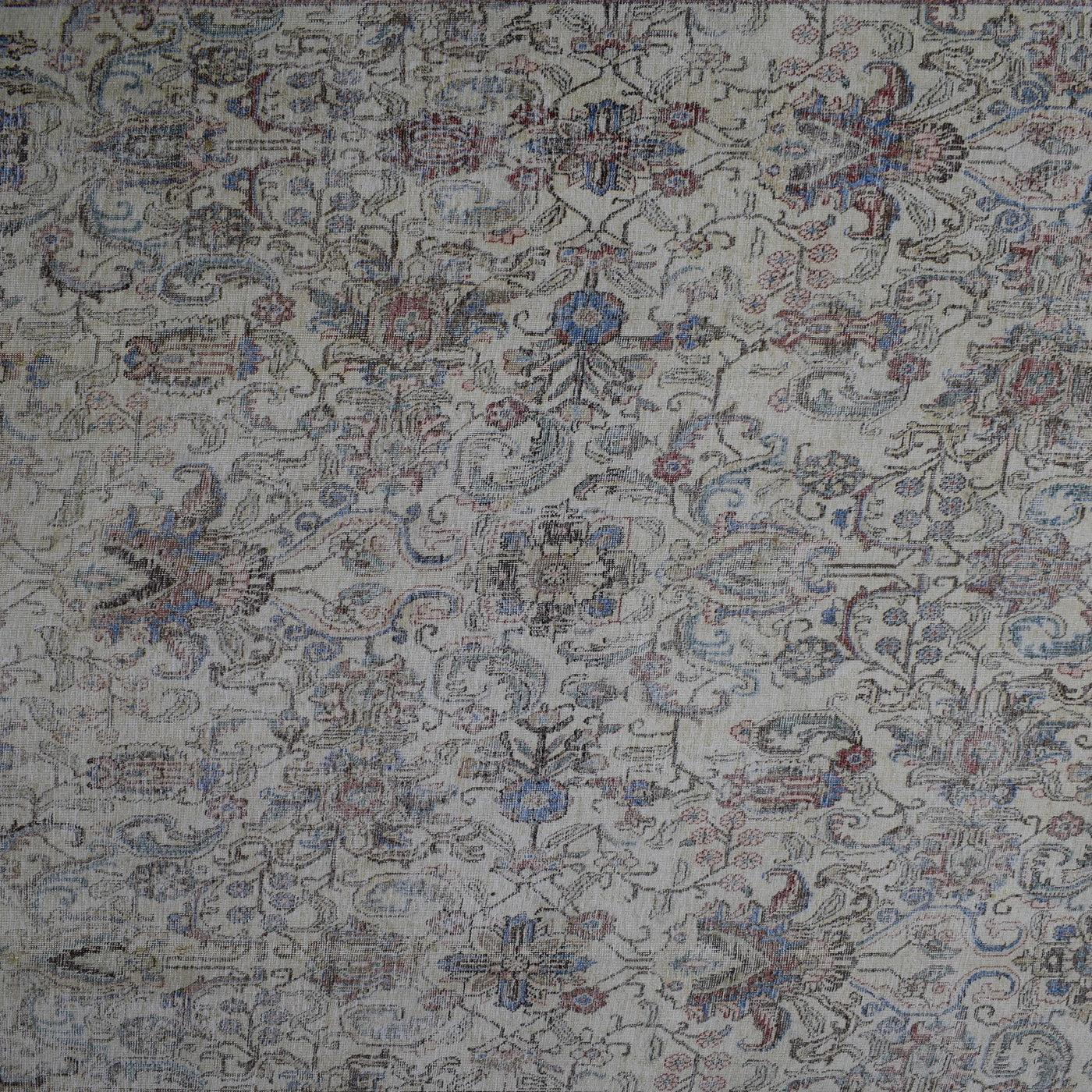 Detailed view of vintage Persian rug pattern featuring traditional Persian floral design in soft blue and beige tones