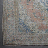 Corner detail of Persian rug with decorative border and traditional Persian floral motifs