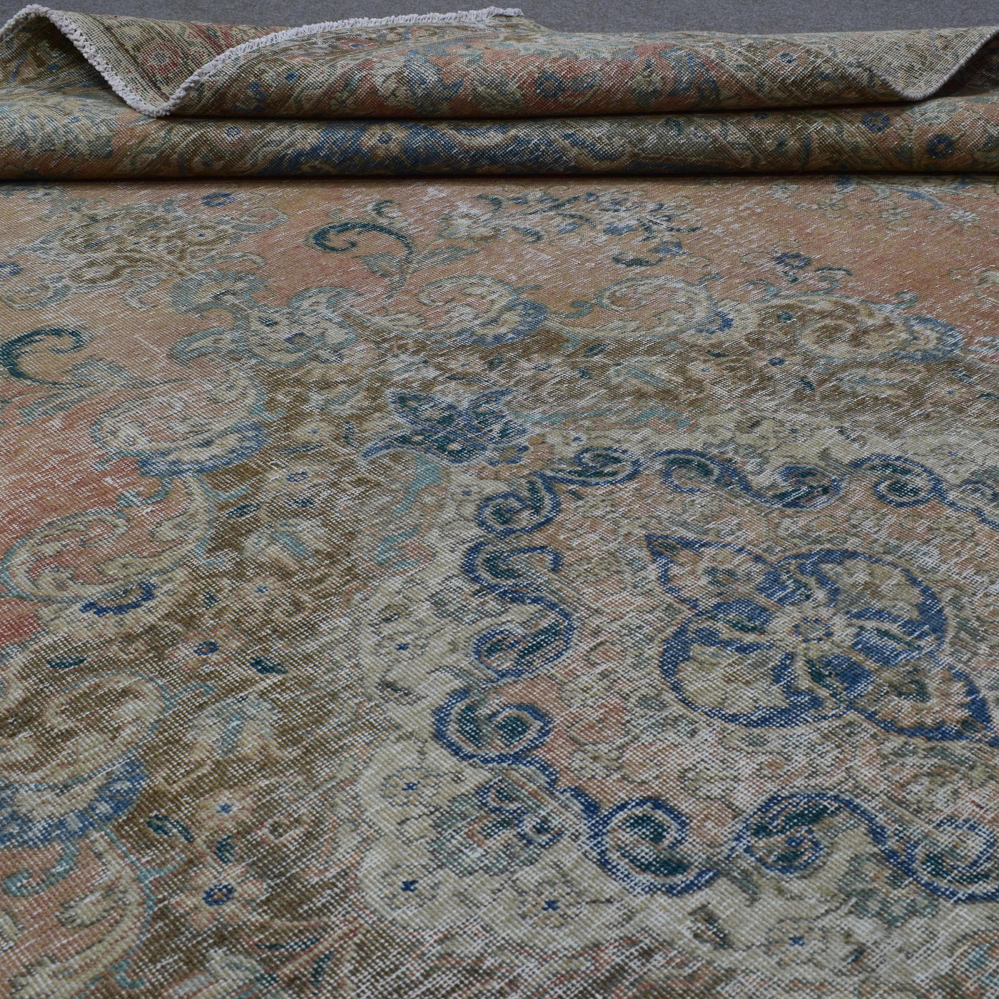 Close up of Persian rug border with floral motifs and intricate guard stripes