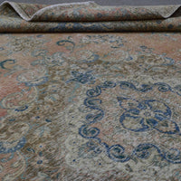 Close up of Persian rug border with floral motifs and intricate guard stripes