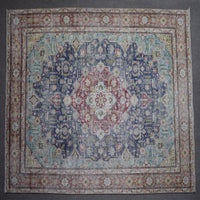 Close up of Persian rug border with colorful floral motifs and intricate guard stripes