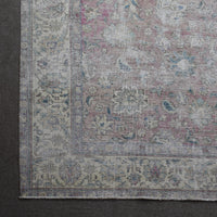 Corner detail of Persian rug with decorative border and traditional Persian motifs
