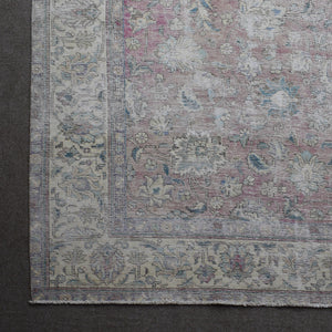 Corner detail of Persian rug with decorative border and traditional Persian motifs