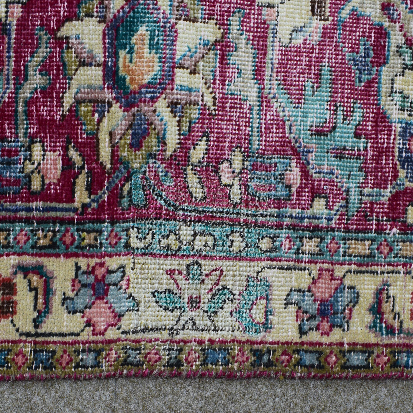 Backside of hand knotted Persian rug showing weave structure and authentic handmade construction