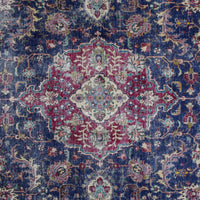 Detailed view of vintage Persian rug medallion featuring traditional Persian floral design on navy field