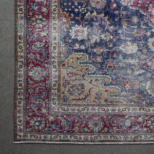 Corner detail of Persian rug with decorative border and classic Persian motifs