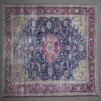 Close up of Persian rug border with colorful floral motifs and intricate guard stripes