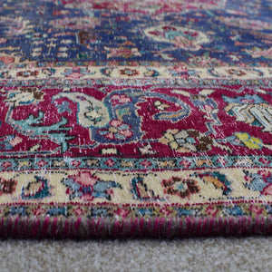 Macro detail of Persian rug medallion highlighting dense floral elements and wool texture