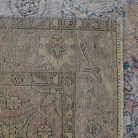 Backside of hand knotted Persian rug showing weave structure and authentic handmade construction