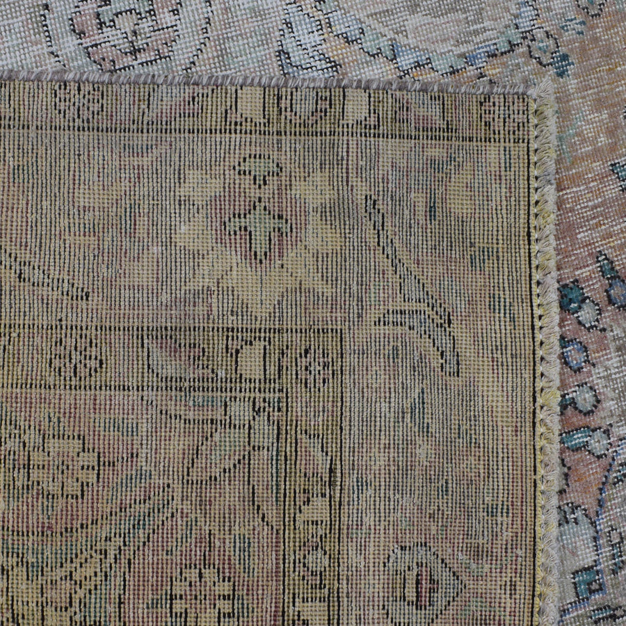Backside of hand knotted Persian rug showing weave structure and authentic handmade construction