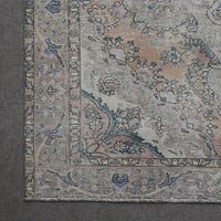Corner detail of Persian rug with decorative border and classic Persian floral motifs