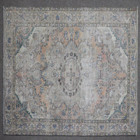 Close up of Persian rug border with blue floral motifs and intricate guard stripes