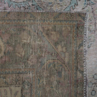 Backside of hand knotted Persian rug showing weave structure and authentic handmade construction