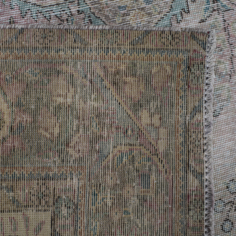 Backside of hand knotted Persian rug showing weave structure and authentic handmade construction