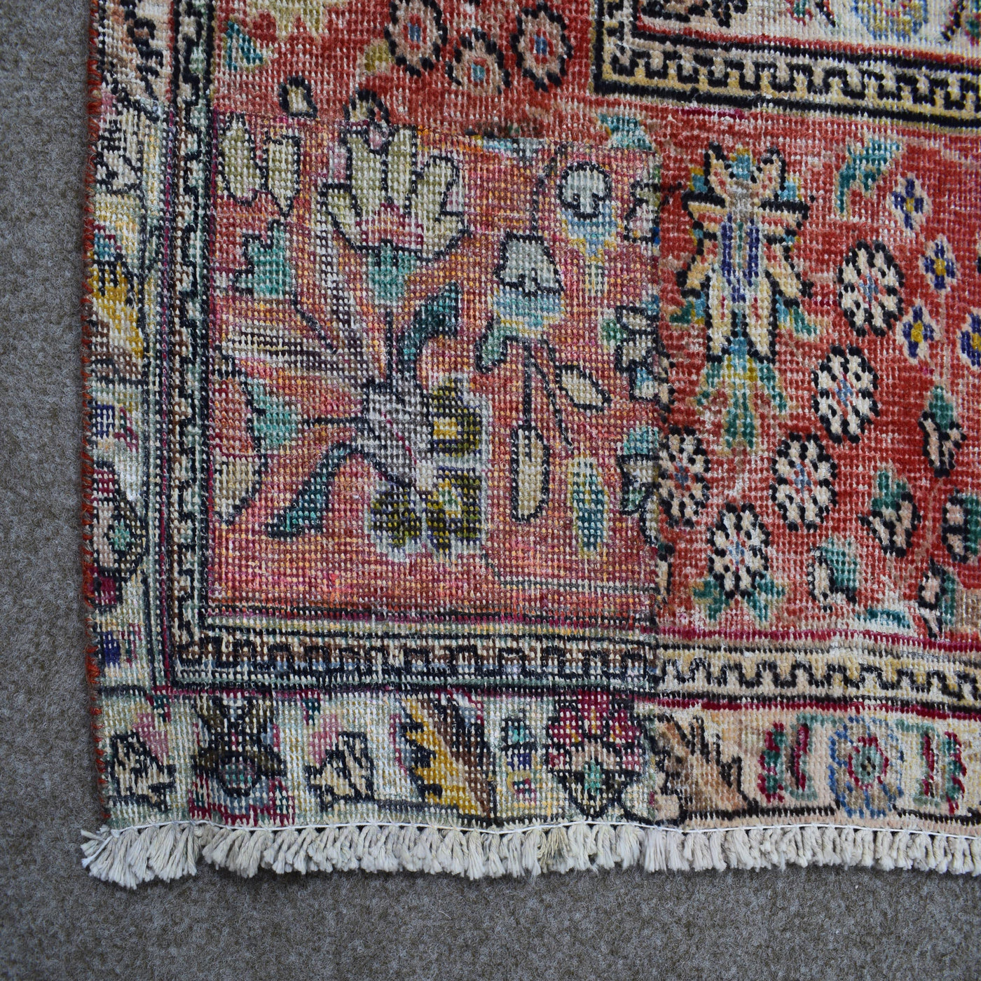 Backside of hand knotted Persian rug showing weave structure and authentic handmade construction