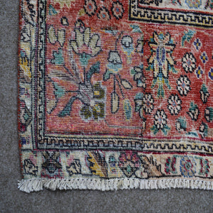 Backside of hand knotted Persian rug showing weave structure and authentic handmade construction